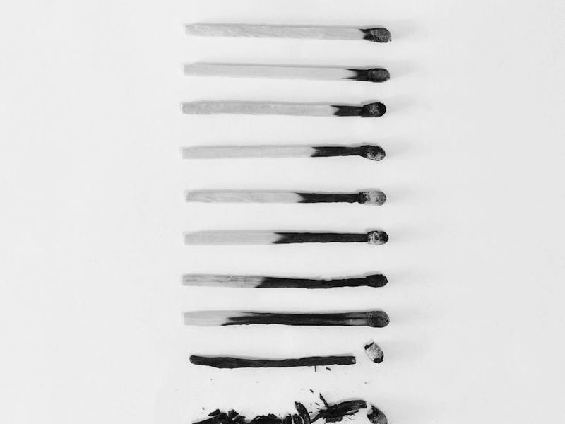 A sequence of silhouettes showing the progression of an exercise.